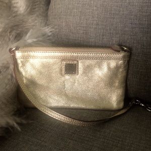 Dooney & Bourke gold metalic wristlet